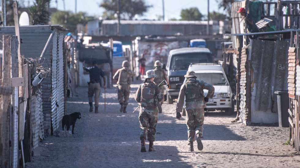 South African law enforcement officials patrol the streets of Lavender, Hillview in Cape Town