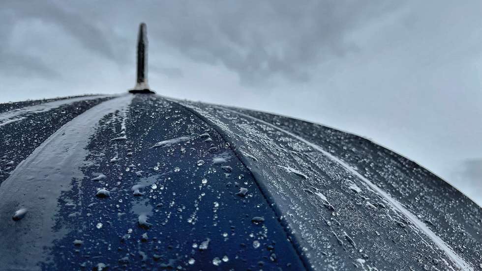 Rain On Window And Umbrella