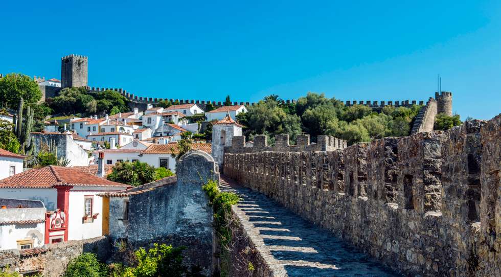 Stone walkway and Obidos cityscape, Leiria, Portugal