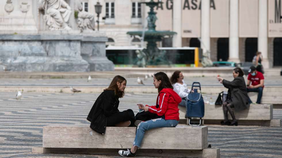 People seen relaxing at the Rossio square, in downtown