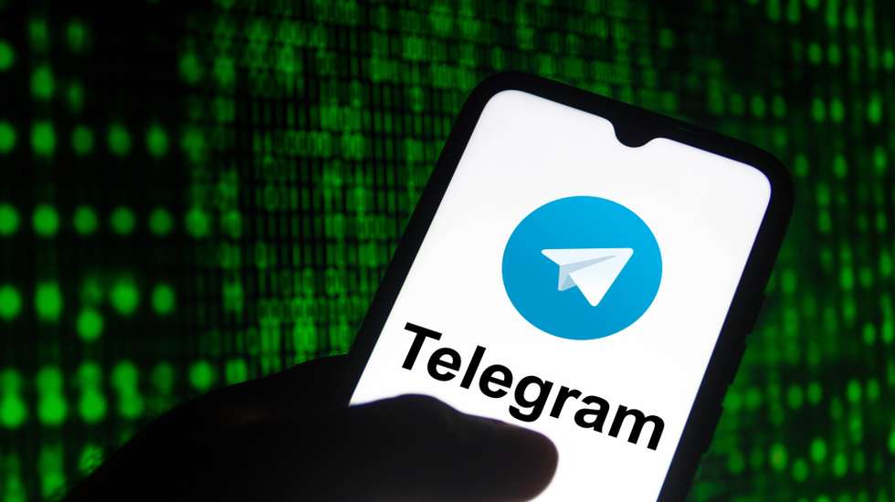 In this photo illustration the Telegram logo seen displayed
