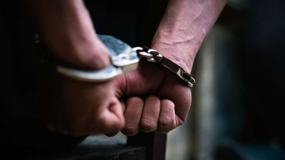 Cropped Hand Of Handcuffs