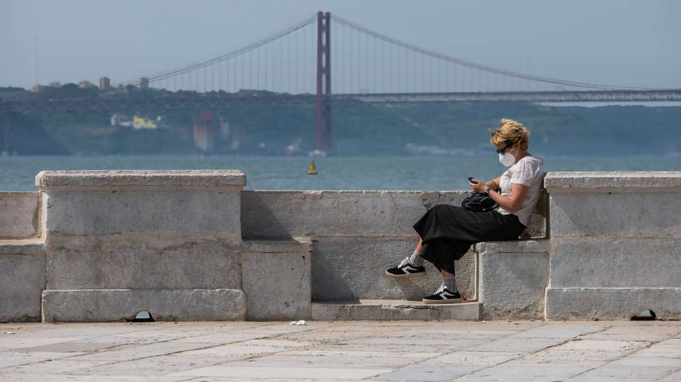 A woman wearing a face mask as a preventive measure against