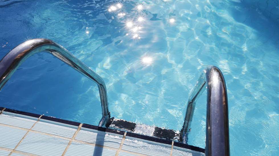 Ladder into swimming pool