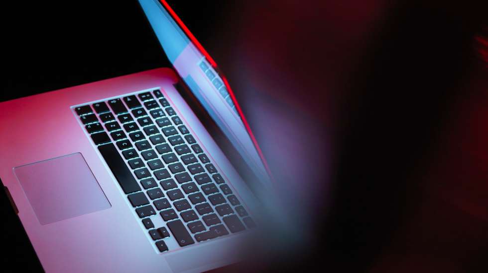 Cyber attack, laptop computer being infected by virus