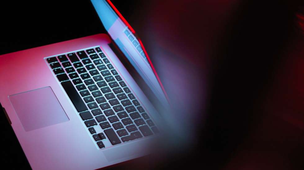 Cyber attack, laptop computer being infected by virus