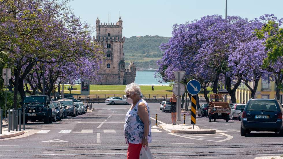 Woman crossing the street in Belem
