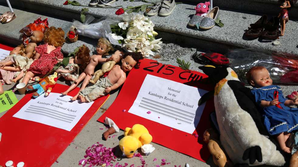 215 pairs of children's shoes set up in Vancouver as tribute after residential school discovery
