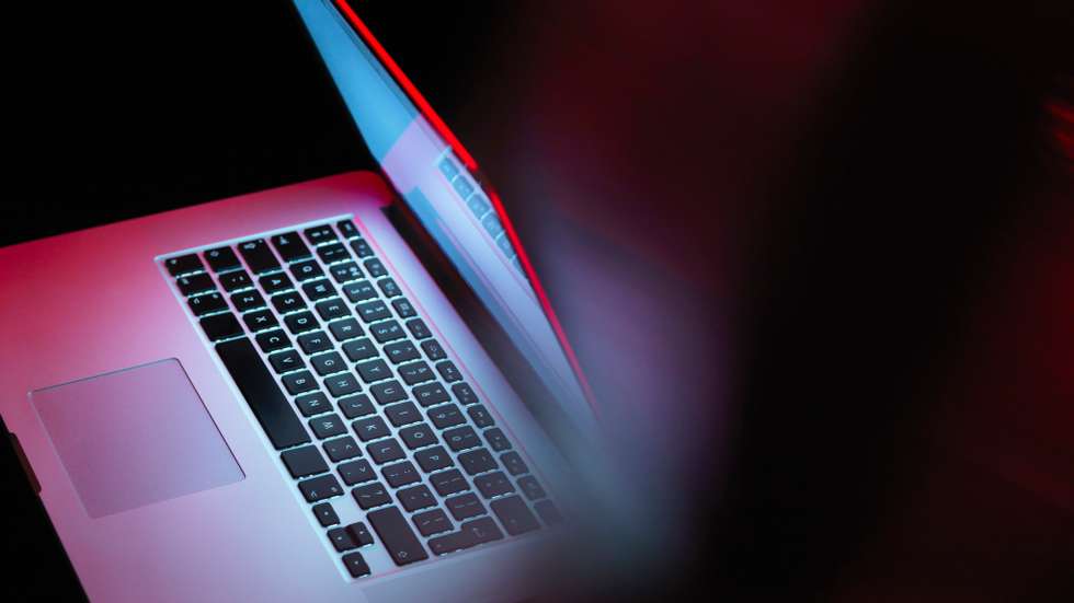 Cyber attack, laptop computer being infected by virus