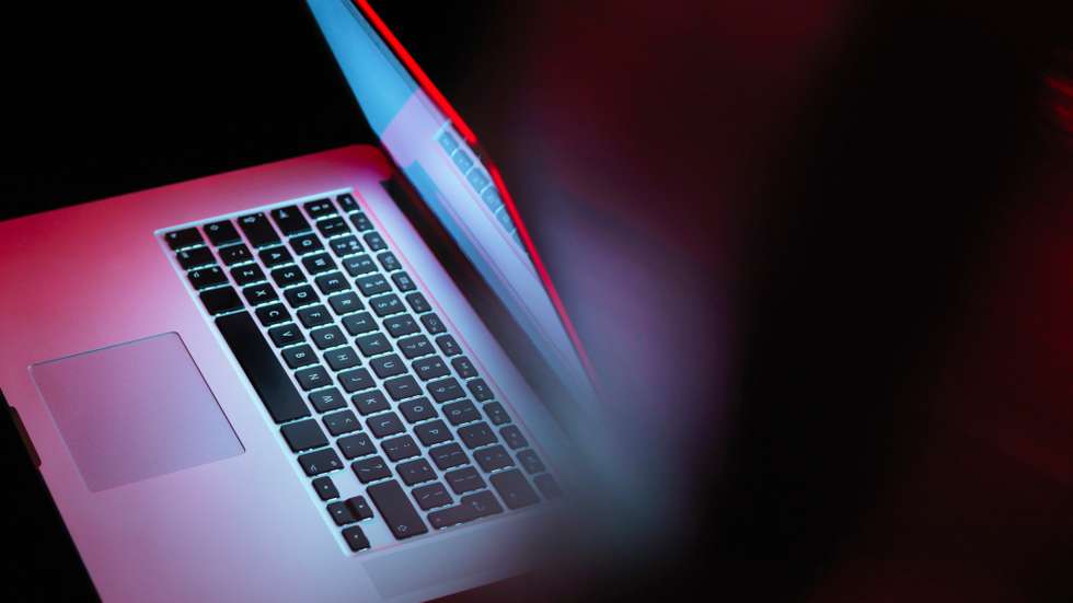 Cyber attack, laptop computer being infected by virus