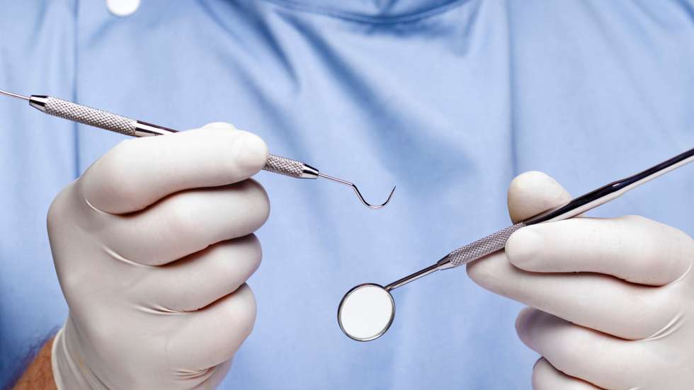 Dentist doing dental examination