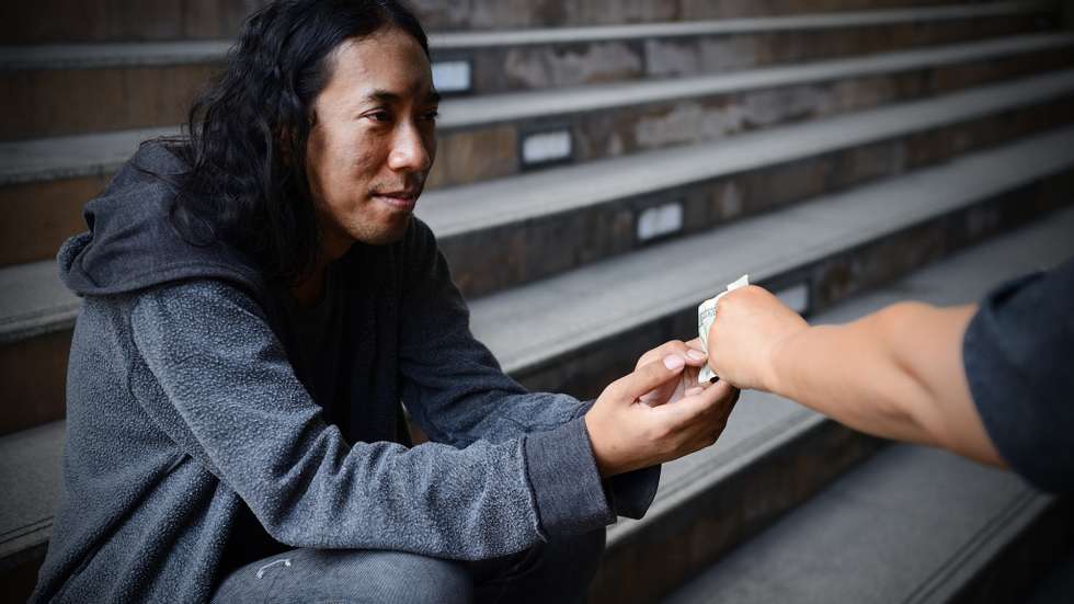 Homelessness Poor man, Beggar is begging for money on the street, Hands of Beggar with penny Coin begging for the money