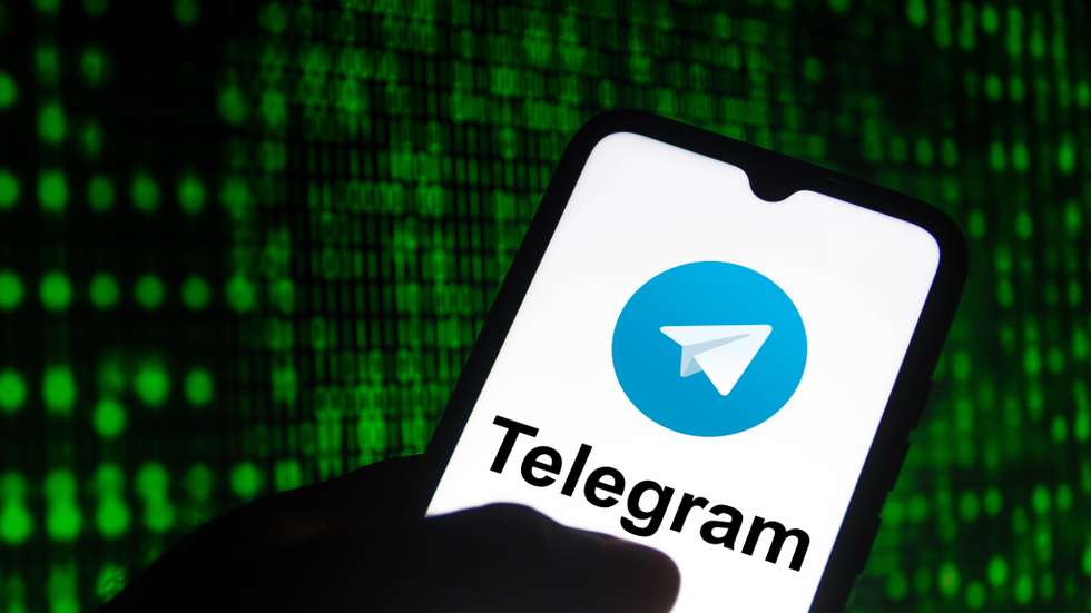 In this photo illustration the Telegram logo seen displayed