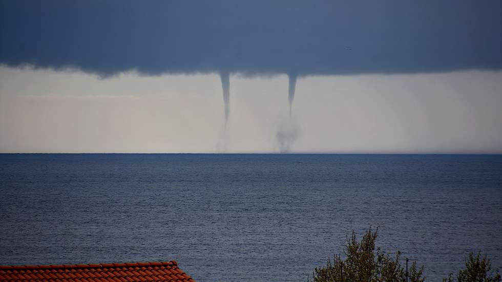 Tornadic waterspouts are seen on the sea off Marseille