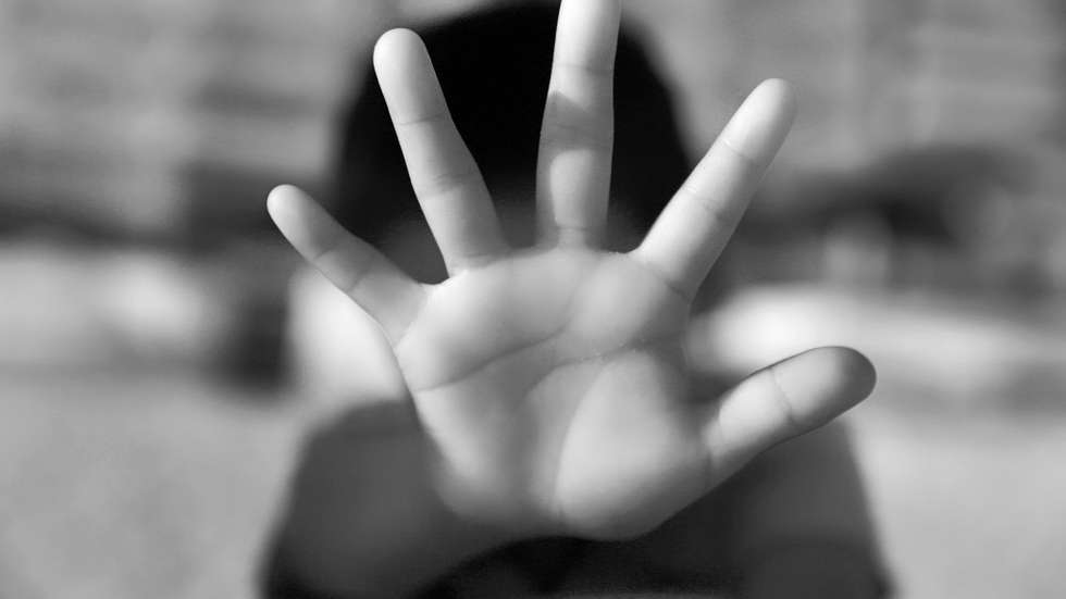 Close-up of woman showing stop gesture