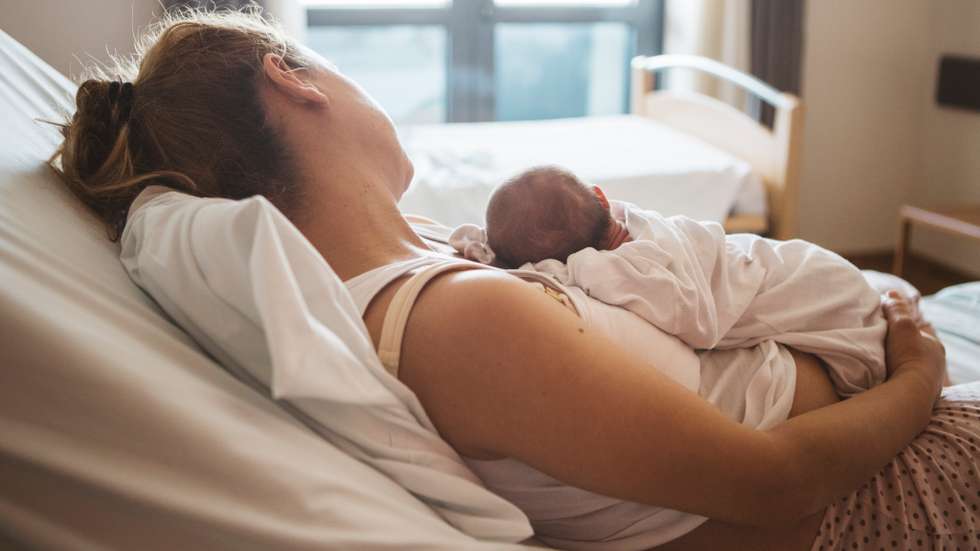 Mother with her newborn baby in the hospital
