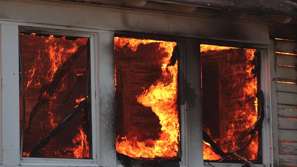 Low Angle View Of House In Fire