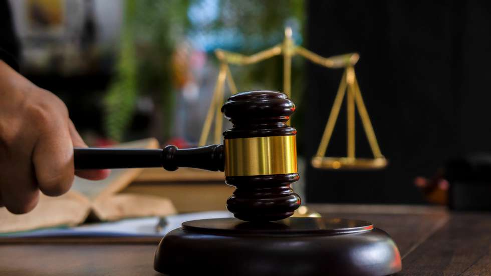 Law and justice concept. Judge's gavel, scales, hourglass, books.