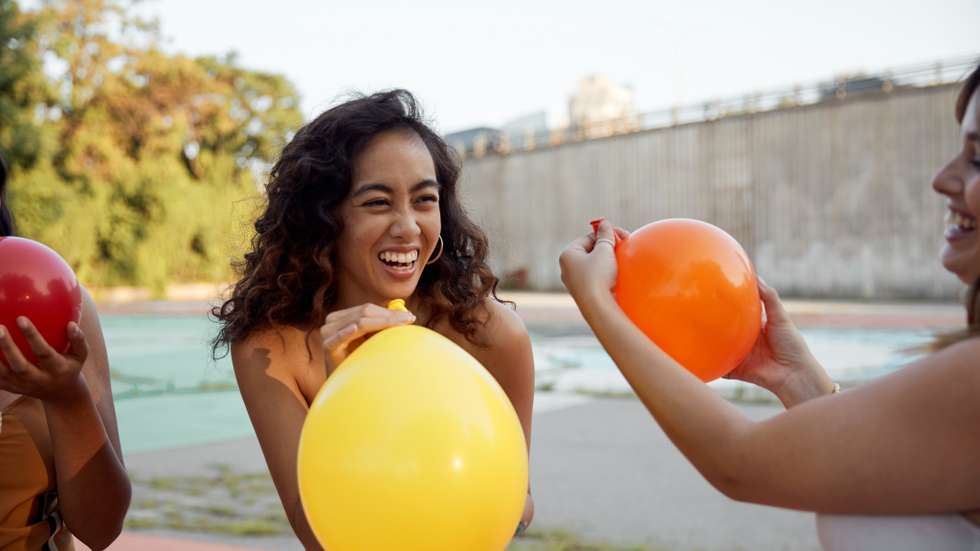 Female having fun with party balloon