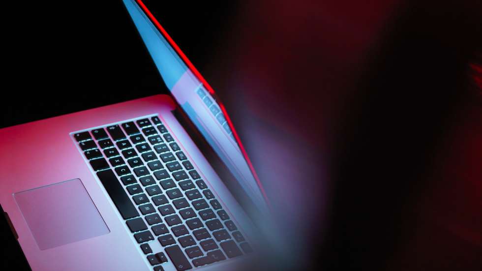 Cyber attack, laptop computer being infected by virus