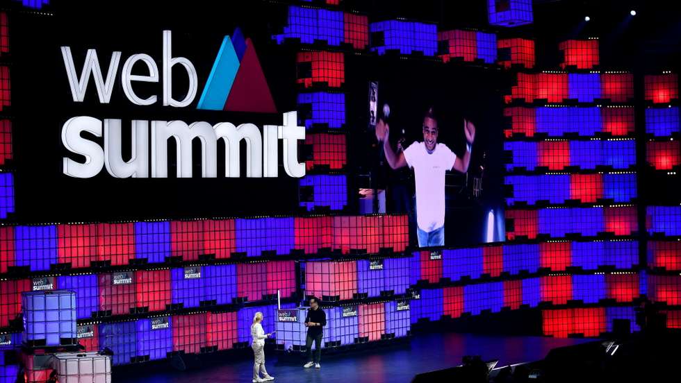4 November 2021; PITCH winner Antonio Rocha; Co-founder; Smartex.ai is shown on screen as Hanna Hennig, CIO, Siemens, and Casey Lau, RISE, Co-Host Web Summit wait on Centre Stage during day three of Web Summit 2021 at the Altice Arena in Lisbon, Portugal. Photo by Piaras Ó Mídheach/Web Summit via Sportsfile
