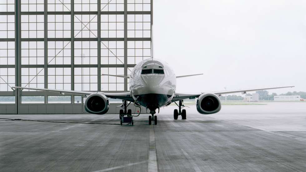 Commercial aircraft in hangar