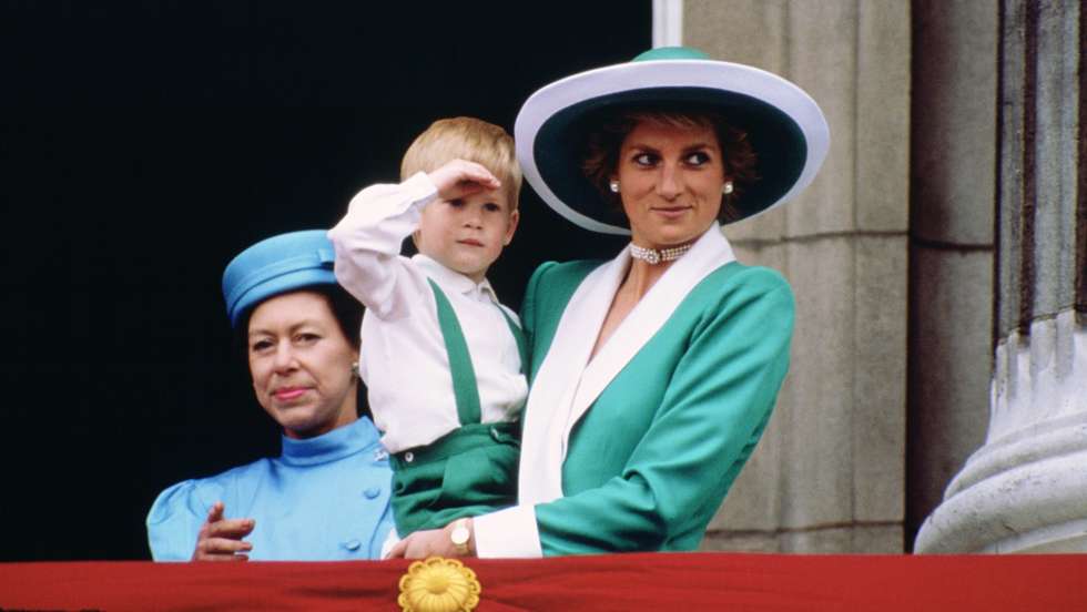Diana, Princess of Wales, holding a young Prince Harry in he