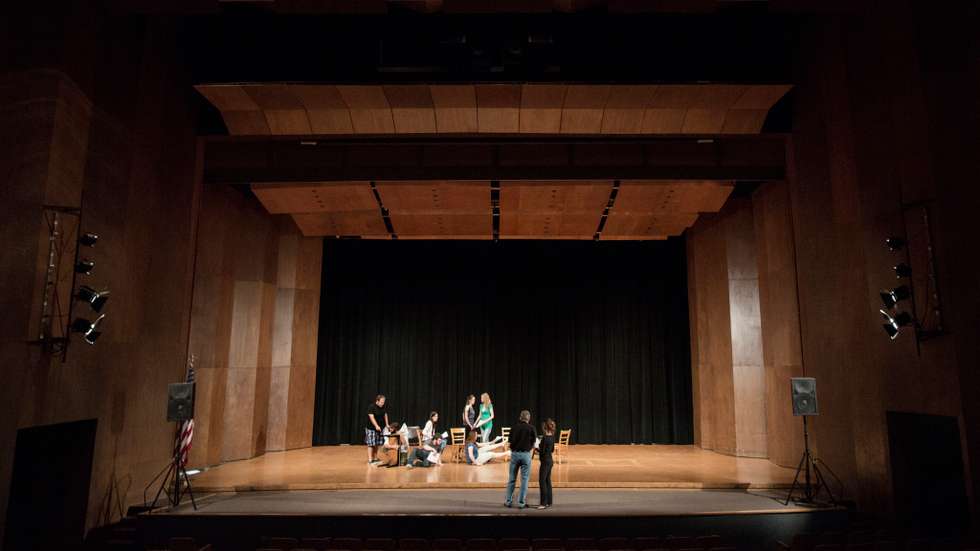 Actors rehearsing on stage
