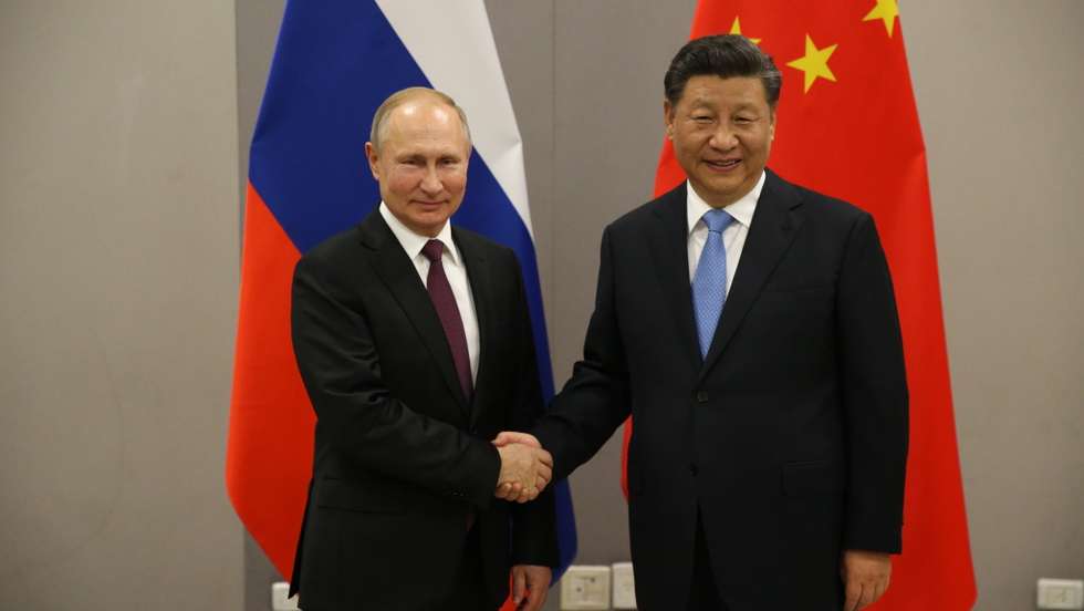 Russian President Vladimir Putin meets Chinese President Xi Jinping at BRICS Summit in Brasilia
