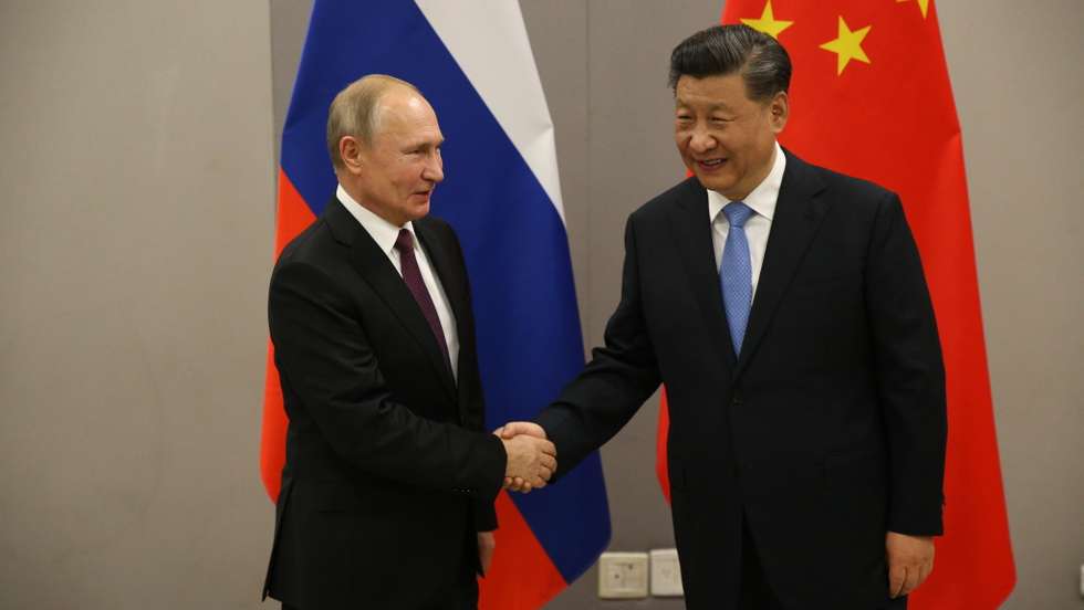 Russian President Vladimir Putin meets Chinese President Xi Jinping at BRICS Summit in Brasilia