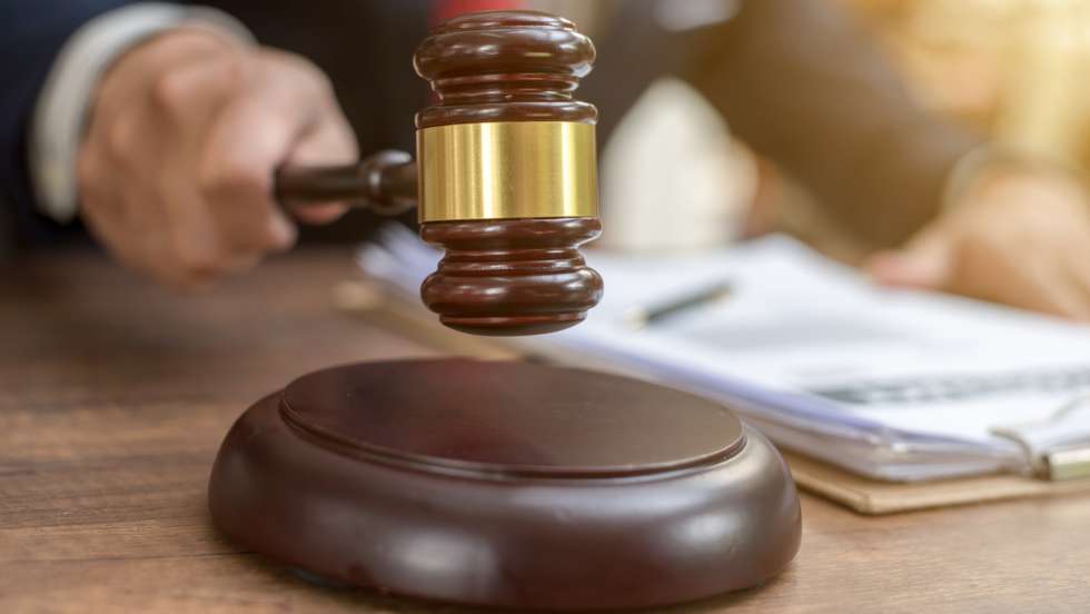 Close up lawyer businessman working or reading lawbook in office workplace for consultant lawyer concept.