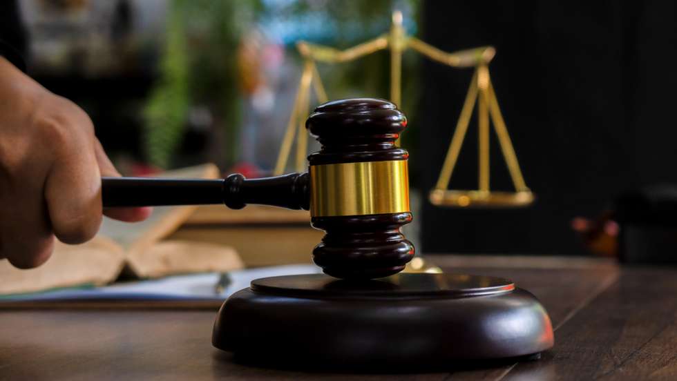 Law and justice concept. Judge's gavel, scales, hourglass, books.