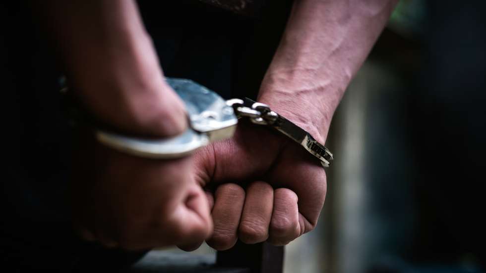 Cropped Hand Of Handcuffs