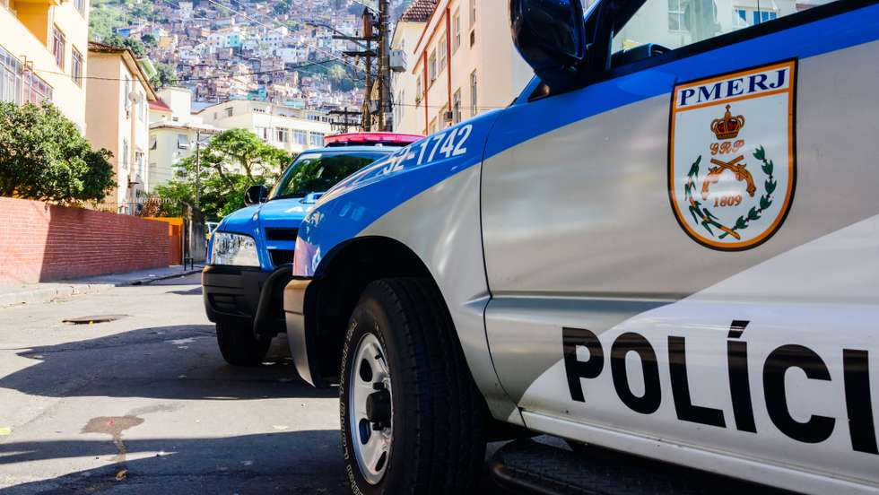 Police car in front of slum