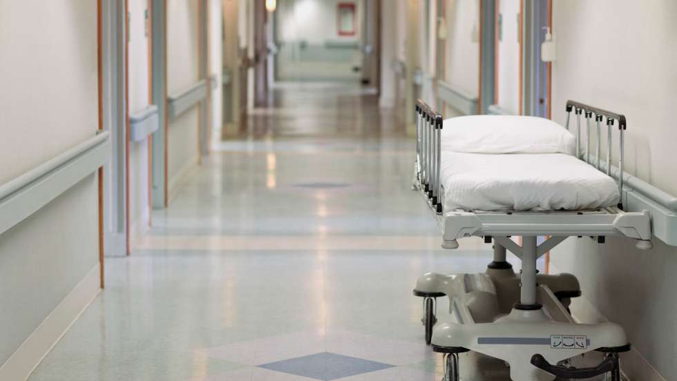 Portable hospital bed in hallway