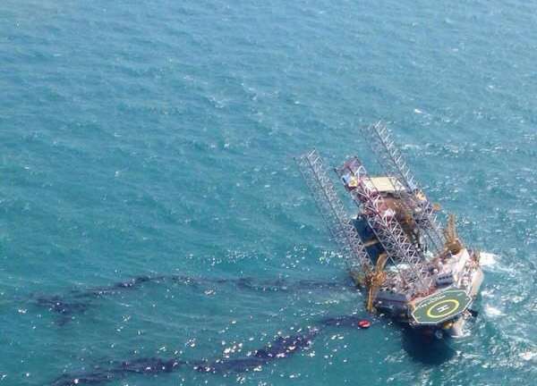 epa04734577 Photo shows the oil exploration rig Troll Solution tilting after an accident while preparing for the maintenance of works near the coast of Campeche state, Mexico, 05 May 2015. According sources of state Petroleos Mexicano (Pemex) company, two men died after the platform tilted during work preparations.  EPA/José Luis Hernández