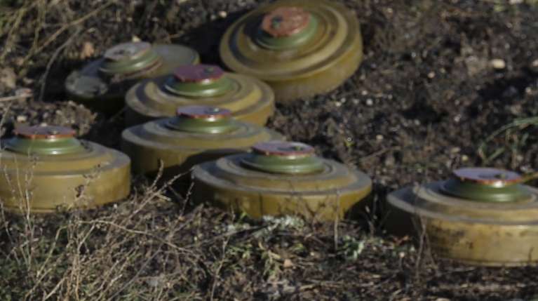 epa10341777 A sign reads 'Stop mines' set up next to during a demining operation not far from Bakhmut, Donetsk region, Ukraine, 01 December 2022. On 24 February 2022 Russian troops entered the Ukrainian territory in what the Russian president declared a 'Special Military Operation', starting an armed conflict that has provoked destruction and a humanitarian crisis.  EPA/ALESSANDRO GUERRA
