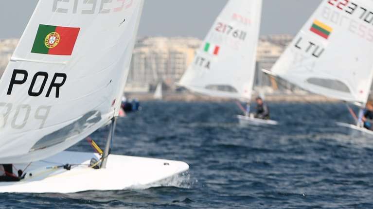 epa11165934 Portuguese Eduardo Marques (C) competes in the 2024 ILCA7 &amp; ILCA 6 Men’s European Championships &amp; Open European Trophy Olympic qualifier for Paris 2024, in the coast city of Alimos, Greece, 19 February 2024.  EPA/ALEXANDROS BELTES