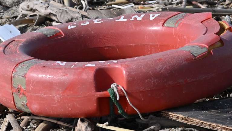 epa10496753 Debris washed up on the beach, three days after a boat of migrants sank off the coast, in Steccato di Cutro, Crotone Province, southern Italy, 01 March 2023. The death toll from a shipwreck off Calabria's coast in southern Italy rose to 67 on 01 March 2023, while three men were in detention accused of human trafficking, Italian officials said. A boat carrying migrants sank in rough seas near the Calabrian coast on 26 February.  EPA/CARMELO IMBESI
