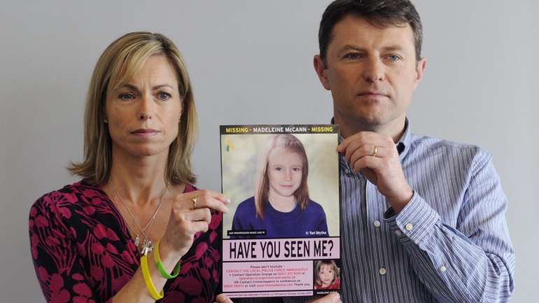 Kate e Gerry McCann com a foto da filha, Madeleine