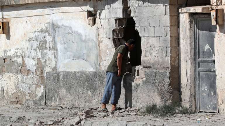 Destruição na zona curda de  Akcakale, na Síria, perto da fronteira com a Turquia