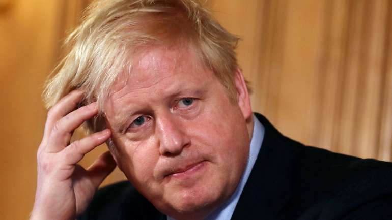 Boris Johnson na conferência de imprensa de quinta-feira, em que defendeu a estratégia da imunidade de grupo