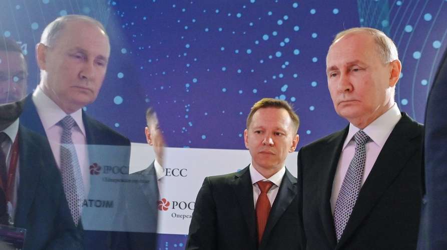 epa10744055 Russian President Vladimir Putin (C), accompanied by Russian Railways (RZhD) CEO - Chairman of the Executive Board Oleg Belozerov (R), visits an exhibition of advanced research and development projects in the field of quantum technologies as part of the Future Technologies Forum at the World Trade Center in Moscow, Russia, 13 July 2023.  Putin proposed to develop a national project for the formation of a data economy until 2030 within a year. The President stressed that it is not only about consolidating existing tools to support the development of the digital economy, artificial intelligence and high-tech projects, including the roadmaps for the development of quantum technologies, which are discussed at the forum, as well as developments in the field of quantum technologies.  EPA/ALEXANDER KAZAKOV/KREMLIN / POOL MANDATORY CREDIT