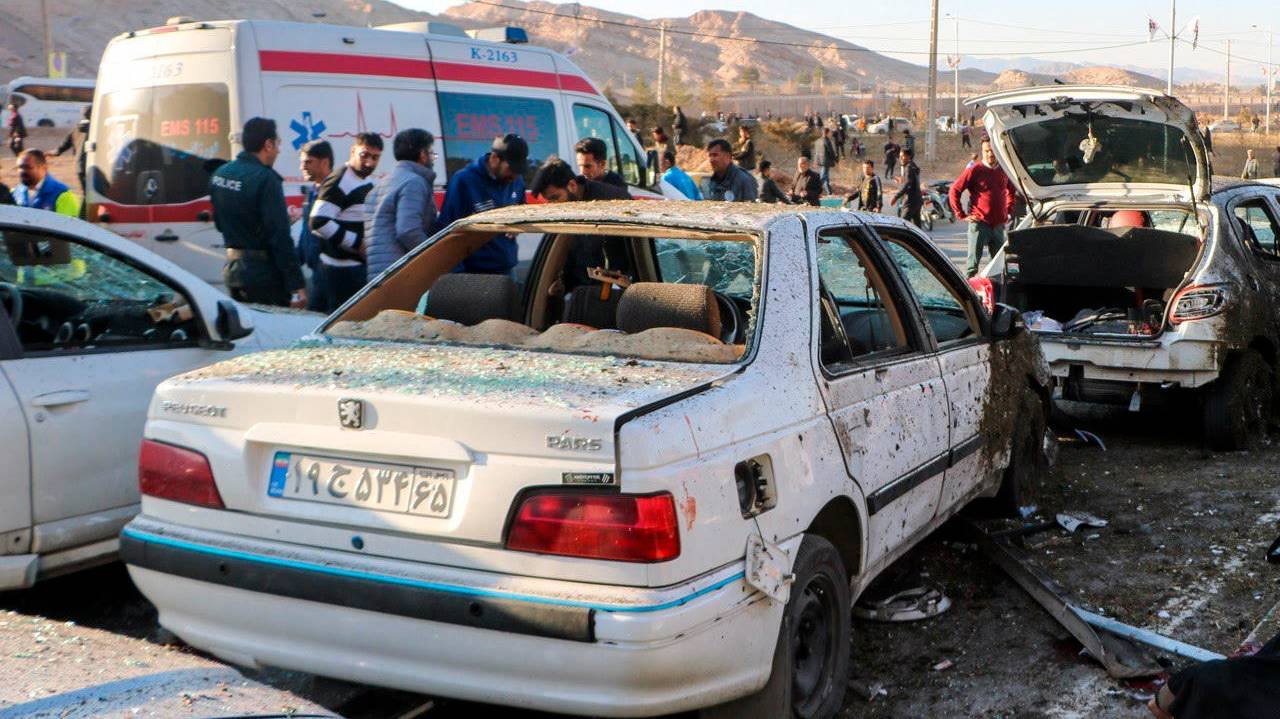 epa11055381 Damaged cars are seen as people try to help victims after an explosion next to the tomb of Iran&#039;s Revolutionary Guards chief of foreign operations in the Saheb al-Zaman mosque in the southern city of Kerman, Iran 03 January 2024. On the fourth anniversary of the US-initiated assassination of Iranian General Qasem Soleimani, two bomb explosions have killed at least 103 people and another 171 people were wounded close to his mausoleum, according to Iranian official television. As part of a ceremony to honor General Soleimani, who was killed in a US drone strike in neighboring Iraq in 2020, hundreds of people were on their way towards the grave on 03 January.  EPA/TASNIM NEWS AGENCY