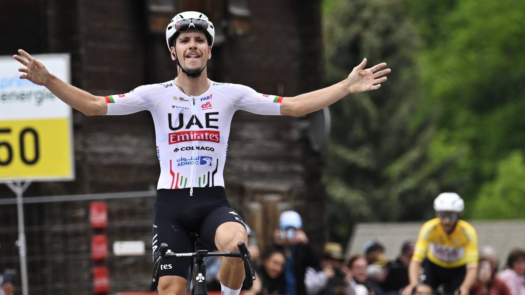 epa11409751 UAE Team Emirates rider Joao Almeida of Portugal celebrates winning the sixth stage of the Tour de Suisse, a 42.5km cycling race from Ulrichen to Blatten-Belalp, Switzerland, 14 June 2024.  EPA/GIAN EHRENZELLER