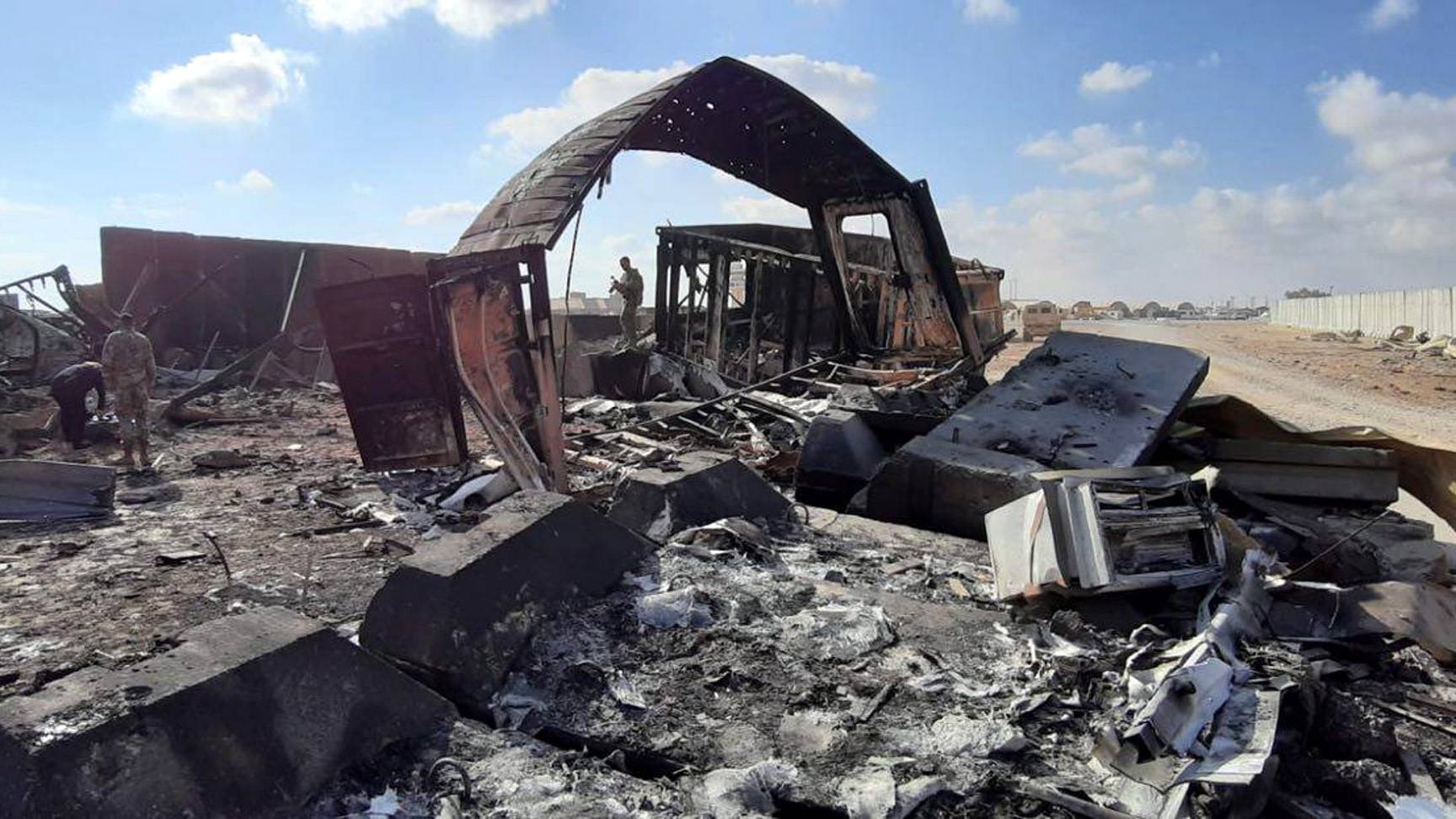 epa08127720 US soldiers stand next the damage that caused by the Iran&#039;s missiles attack inside Ain al-Assad air base in Anbar province, Iraq, 14 January 2020. Iran&#039;s Revolutionary Guard Crops (IRGC) launched a series of rockets targeting Ain al-Assad air base located in al-Anbar on 08 January 2020, one of the bases hosting US military troops in Iraq. The attack comes days after the Top Iranian General Qasem Soleimani, head of the IRGC&#039;s Quds force, was killed by a US drone strike in Baghdad.  EPA/STR