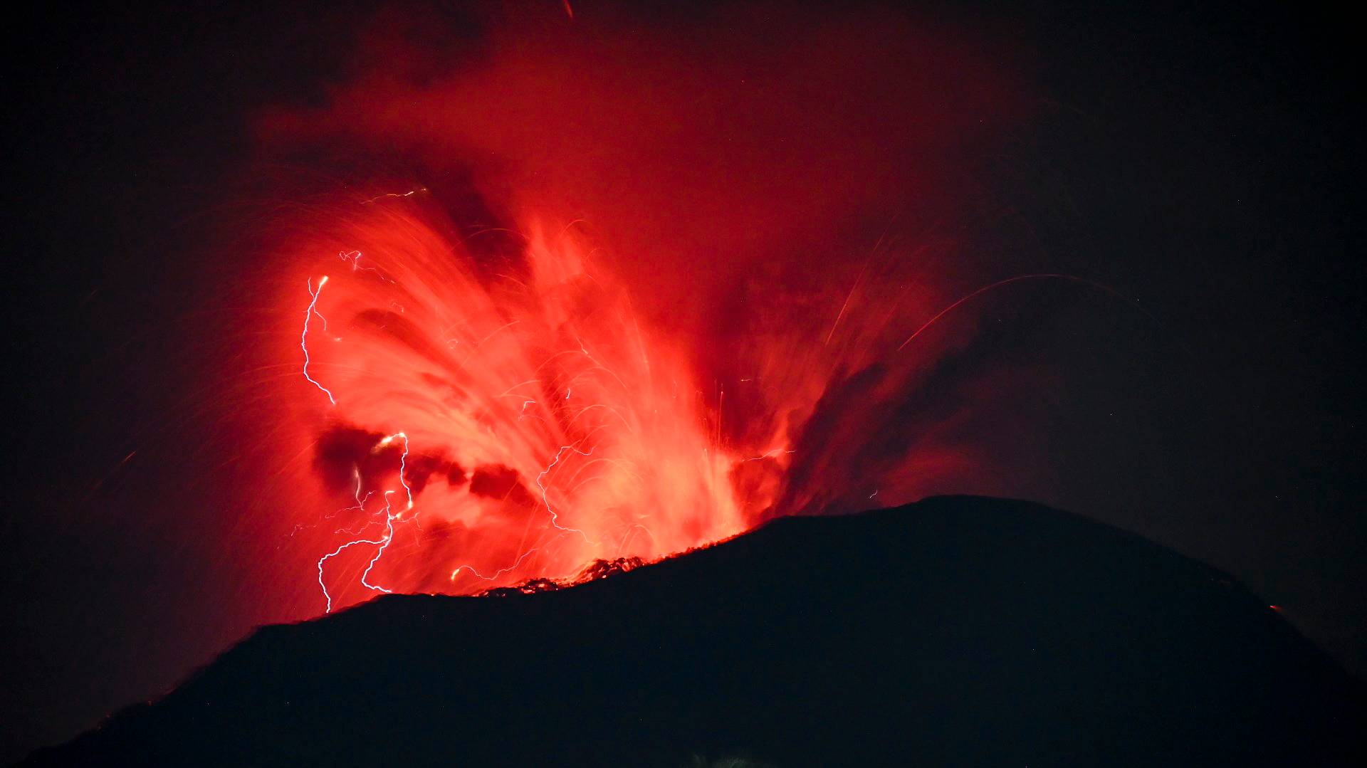 epa11392502 A handout photo made available by the Vulcanology and Geological Disaster Mitigation Center of the Indonesian Ministry of Energy and Mineral Resources (PVMBG) shows Mount Ibu volcano spewing volcanic materials during an eruption in West Halmahera, North Maluku, Indonesia, 06 June 2024. The volcano erupted twice on 06 June 2024, releasing volcanic clouds and red lava up into the air during the eruptions. Mount Ibu remains on the highest alert level according to PVMBG officials.  EPA/PVMBG / HANDOUT HANDOUT, EDITORIAL USE ONLY, NO SALES, BEST QUALITY AVAILABLE HANDOUT EDITORIAL USE ONLY/NO SALES HANDOUT EDITORIAL USE ONLY/NO SALES