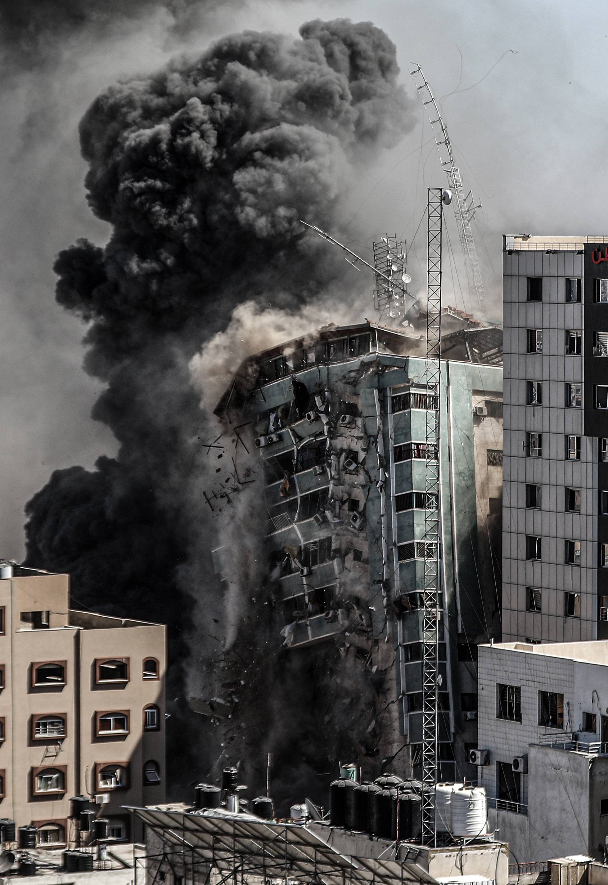 Israeli forces destroy building in Gaza City where Al-Jazeera, Associated Press had their offices