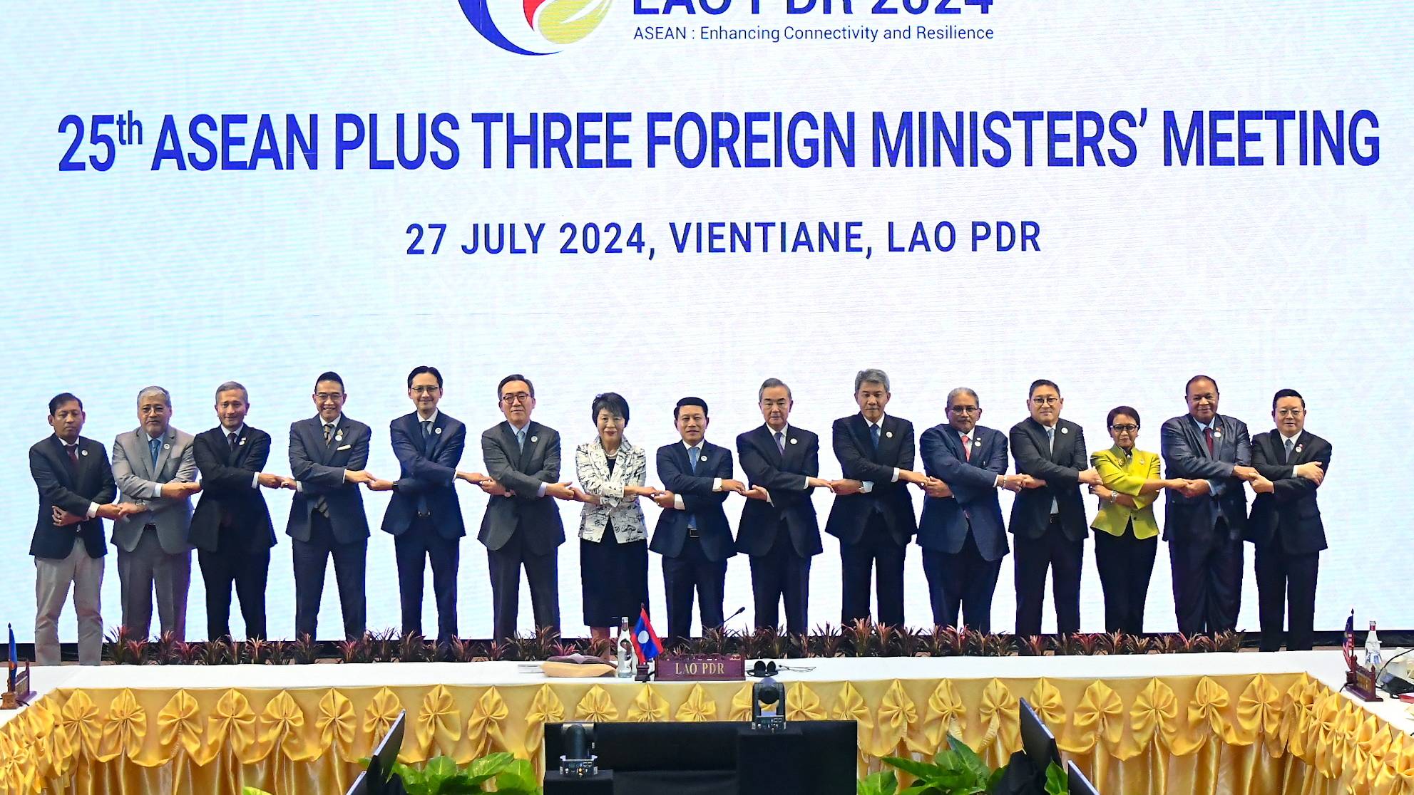 epa11498556 A handout photo made available by Thailand&#039;s Ministry of Foreign Affairs shows (L-R) Myanmar Permanent Foreign Secretary Aung Kyaw Moe, Philippines Secretary of Foreign Affairs Enrique Manalo, Singapore&#039;s Minister of Foreign Affairs Vivian Balakrishnan, Thai Minister of Foreign Affairs Maris Sangiampongsa, Vietnamese Deputy Foreign Minister Do Hung Viet, South Korean Foreign Minister Cho Tae-yul, Japanese Foreign Minister Yoko Kamikawa, Laos Minister of Foreign Affairs Saleumxay Kommasith, China&#039;s Foreign Minister Wang Yi, Malaysian Minister of Foreign Affairs Mohamad Hasan, and Brunei&#039;s Minister of Foreign Affairs Dato Erywan Pehin Yusof, Cambodian Foreign Minister Sok Chenda Sophea, Indonesian Minister of Foreign Affairs Retno Marsudi, East Timor Foreign Minister Bendito dos Santos Freitas, and ASEAN Secretary-General Kao Kim Hourn holding hands for a group photo at the 25th ASEAN Plus Three Foreign Ministers&#039; meeting, part of the 57th ASEAN Foreign Ministers&#039; meeting, in Vientiane, Laos, 27 July 2024. Foreign Ministers of the Association of Southeast Asian Nations (ASEAN) convened at a summit hosted by Laos in the capital of Vientiane to tighten diplomatic relations and discuss the ongoing civil unrest in Myanmar and tension in the South China Sea.  EPA/THAI MINISTRY OF FOREIGN AFFAIRS HANDOUT EDITORIAL USE ONLY/NO SALES