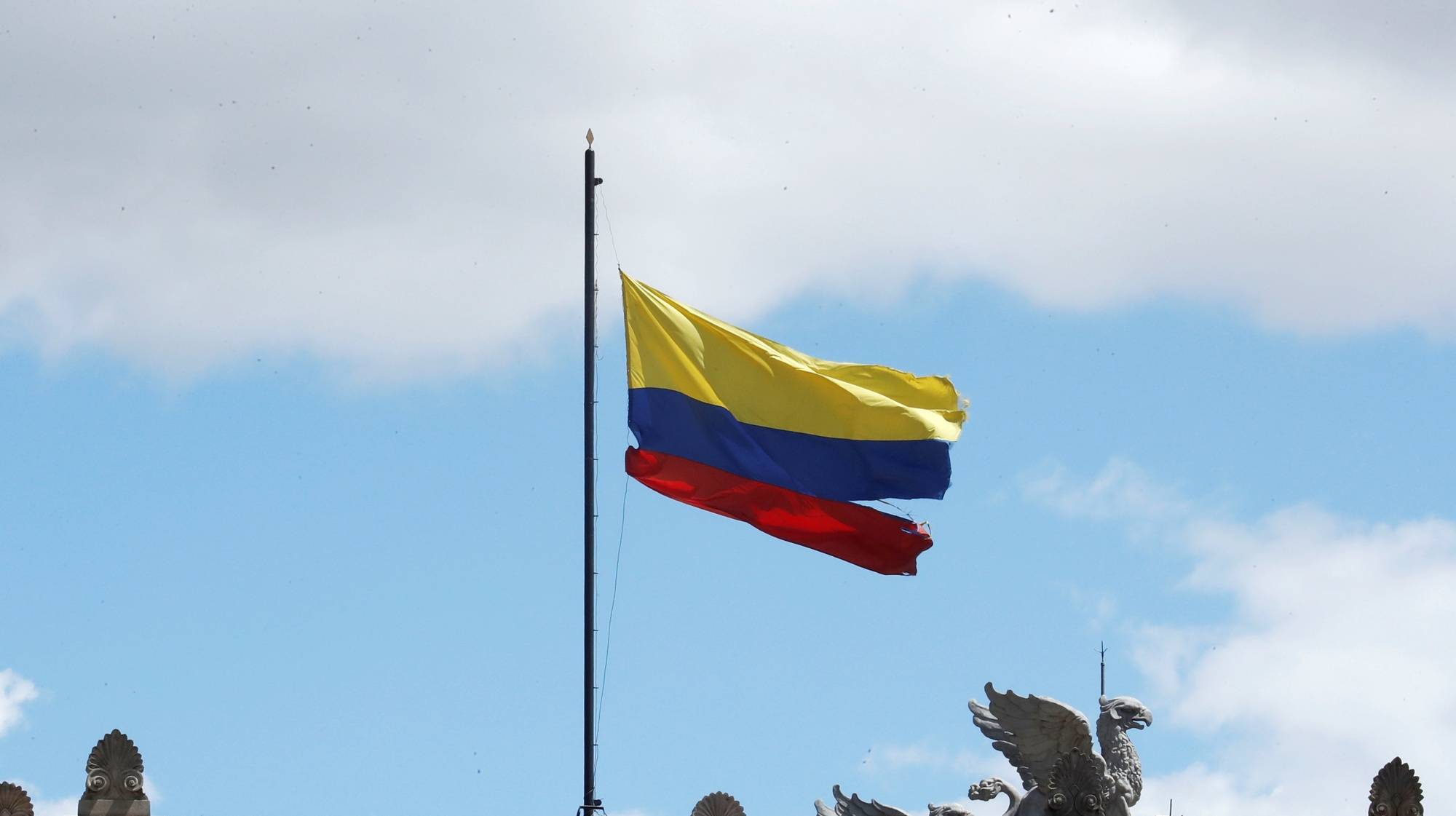 epa09243939 View of the Colombia&#039;s national flag at the headquarter of Colombian Congress during a protest, seen from the Bolivar&#039;s square in Bogota, Colombia, 02 June 2021.  EPA/Mauricio Duenas Castaneda